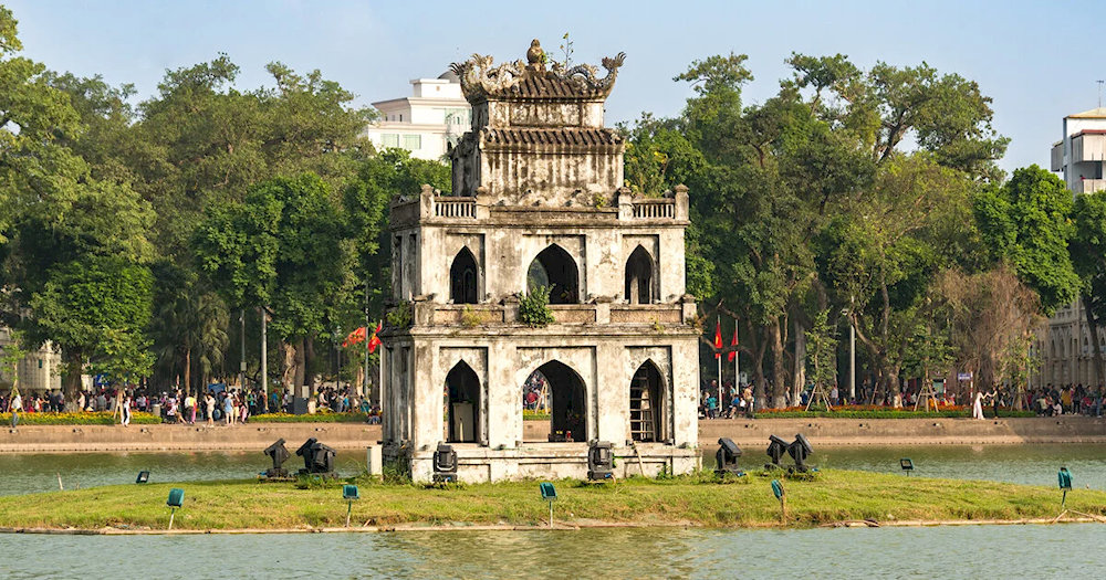 In the middle of the lake stands the ancient Turtle Tower, a symbol of history and legend